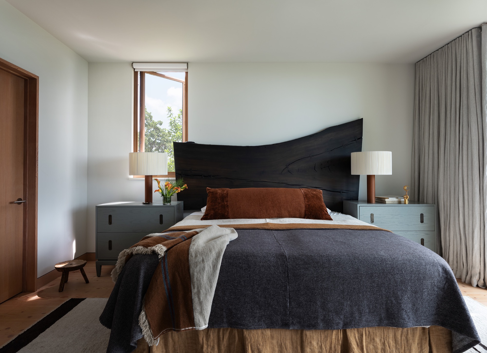 Hillside House bedroom with live-edge headboard in West Lake Hills, Texas